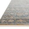 Angled side view showing low pile and beige fringe on Claire Ocean Gold Rug