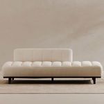 Kenzie Accent Chair styled in a room with a natural fiber rug and neutral wall background