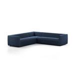 Three-quarter front view from another angle emphasizing sectional’s channel tufted upholstery