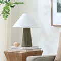Conju accent table lamp styled on wooden side table with books and plant in cozy living room corner