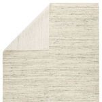 Back and folded corner view revealing the rug's flat weave and consistent cream and blue heathered design
