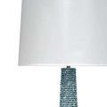 Close-up of blue mango wood beads and white fabric lampshade of Rowan Floor Lamp