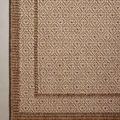 Top-down close-up of rug corner showing woven geometric pattern and contrasting border weave