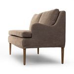 Reverse three-quarter side view showing armrest curve and exposed wooden legs