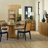 Two Lotus Lamps styled in a spacious dining room with wood furniture, blue framed mirrors, and natural light
