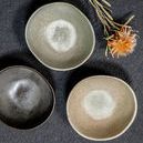 Three Mame Dip Bowls in different colors, beige, light green, and dark grey, styled with dried flowers