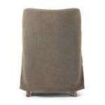 Back view of Brently Dining Chair showing slipcover draping and visible wood legs