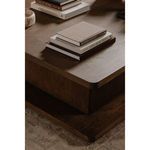 Repeating angled perspective with Casey Coffee Table in cozy room featuring brown sofa and light rug