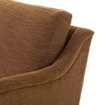 Close-up detail of curved armrest and back cushion upholstery seam on Lynne Sofa.