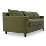 Right angled front view of Hutton sectional showing soft cushions and tapered wood legs