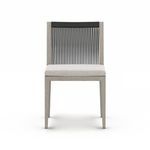 Front view with lighter cushion fabric contrasting wood and rope back