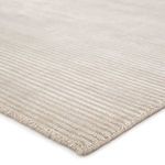 Close-up corner view showing ridged high-low striped texture and edge binding of Basis Solid Light Gray Rug