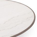 Close-up of marble tabletop corner showing oak edging in detail