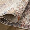 Rolled edge of the rug displaying woven backing and color pattern on the underside