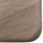Close-up of table top corner showcasing the sandblasted wood texture and rounded edges