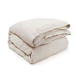 Folded bamboo linen duvet in the same natural beige tone as the sham pillow