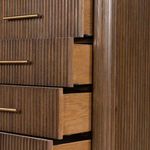 Detailed side angle of partially open drawers revealing wood grain and smooth drawer rails.