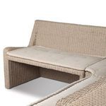 Rear angle showing full height rattan back and fabric cushioned seating