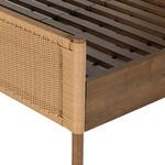 Detail of corner showing wrapped woven rattan around rounded wood post and slats