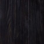 close-up of hand-applied finish texture on dark wood with natural grain variations