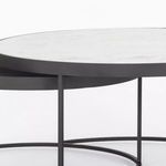 Side detail view showing white marble top overlapping smaller gray lower table