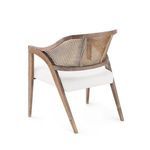 Rear view of Edward Lounge Chair showing curved rattan backrest and angled wooden legs