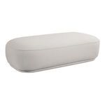 Marion Ottoman shown from angled front view highlighting curved edges and smooth fabric texture