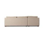 Rear view highlighting tight back panel of sectional and exposed wooden legs