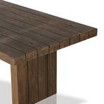 Top-down view emphasizing long, wide wood planks that form the tabletop