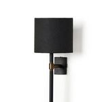 Straight side profile of Maurice Sconce highlighting slim pole, brass arm, and curved shade