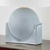 Side view of matte blue spherical ceramic base showing carved details