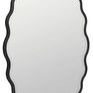 Front view from a slight angle highlighting mirror’s smooth glass and scalloped frame