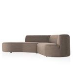 Sectional viewed from the opposite side angle showing backrest curvature and fabric texture