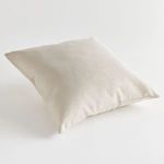 Neutral pillow shown at a three-quarter angle highlighting depth and soft fabric folds