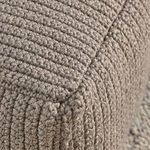 Macro detail of corner with tightly stitched handwoven knitted taupe yarn upholstery