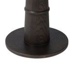 Close-up of dark oak veneer round tabletop with smooth edge