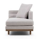 Front view of chaise displaying thick seat cushion with bolstered back pillows