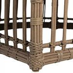 woven rattan base corner with intricate cross-weaving and protective foot pad