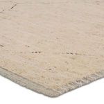 Close-up of Tepal rug showing thick wool pile and detailed woven texture with natural cream fibers