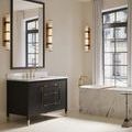 black vanity frame from rear with sink cutout and gold ferrule feet on each corner