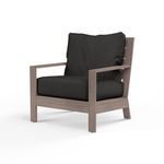 Laguna Club Chair with hand-brushed aluminum frame mimicking driftwood and thick black cushions