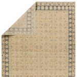Backside flipped corner revealing hand-knotted craftsmanship and muted pattern on reverse side