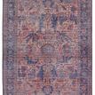 Distressed medallion rug with floral motifs in green, blue, blush, rose, and beige tones, vintage-inspired design