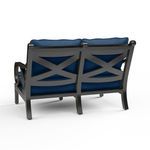 Back view showing X-shaped crossbars in the aluminum frame and blue cushion backs of Monterey Loveseat