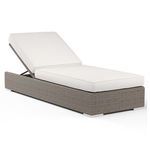 Outdoor chaise with adjustable backrest, resin wicker in driftwood finish, and plush white cushions