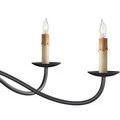 Close-up of two dripping wax candlestick replicas on two gracefully curved black arms