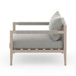 Side angle view emphasizing armrest wrapping and chair’s sturdy wooden frame