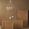 Interior setting with Monte Carlo Vase Set placed on wooden sideboard under white beaded chandelier