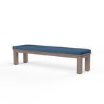 Laguna Dining Bench with hand-brushed driftwood finish aluminum frame and deep blue cushioned top