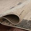 Folded corner close-up showing thickness and weave construction of taupe Bowery Slate rug